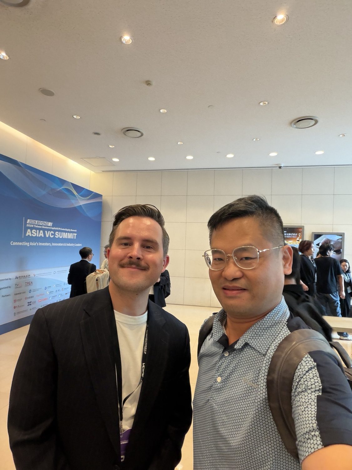 Joel Lin with an international technology exhibitor