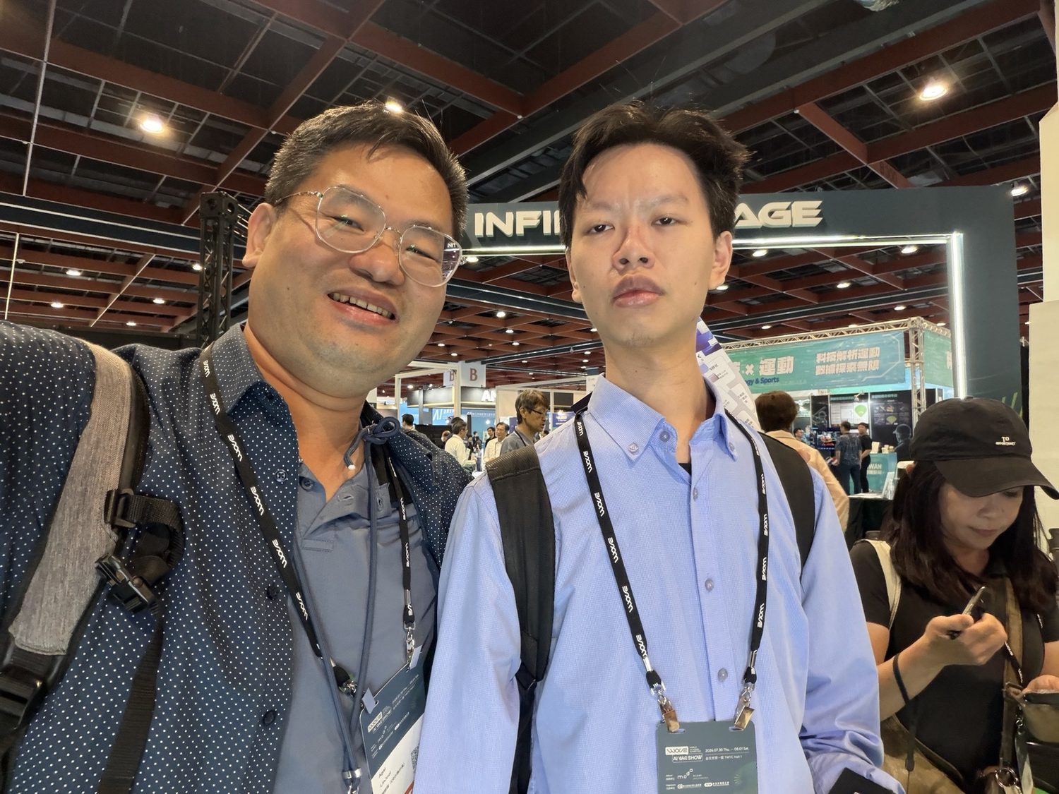 Joel Lin with a participant at an industry exhibition
