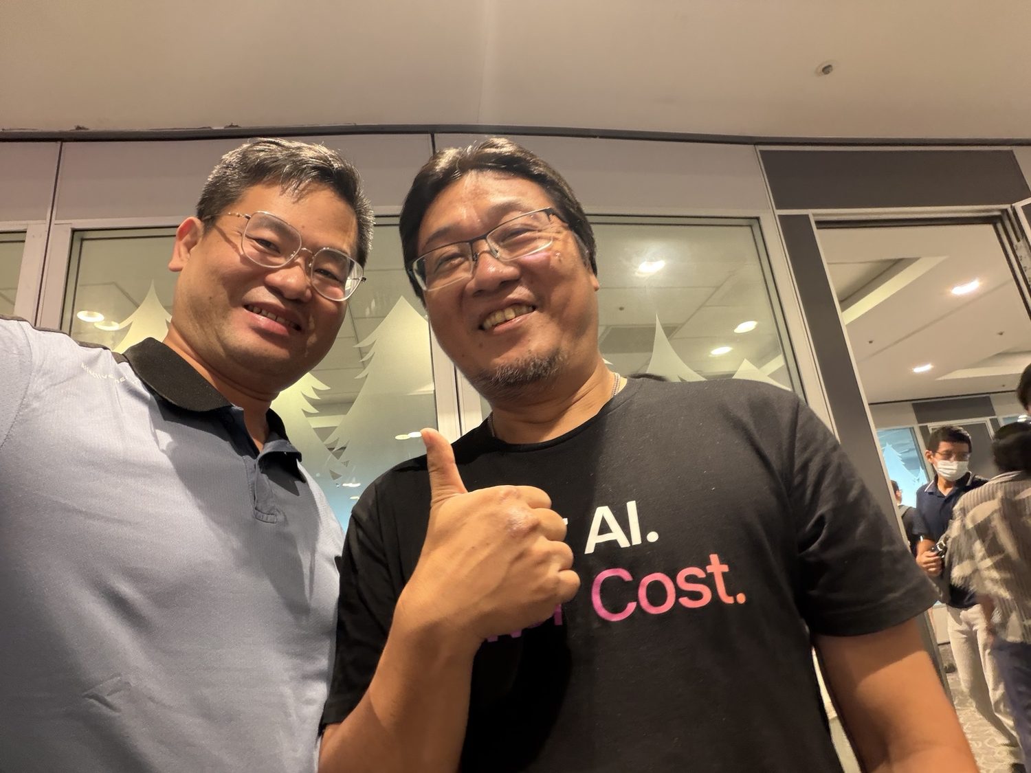 Joel Lin with an AI infrastructure conference participant
