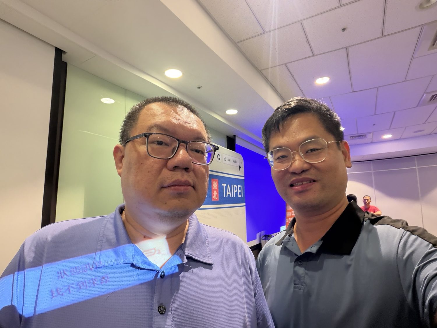 Joel Lin with a technology conference participant